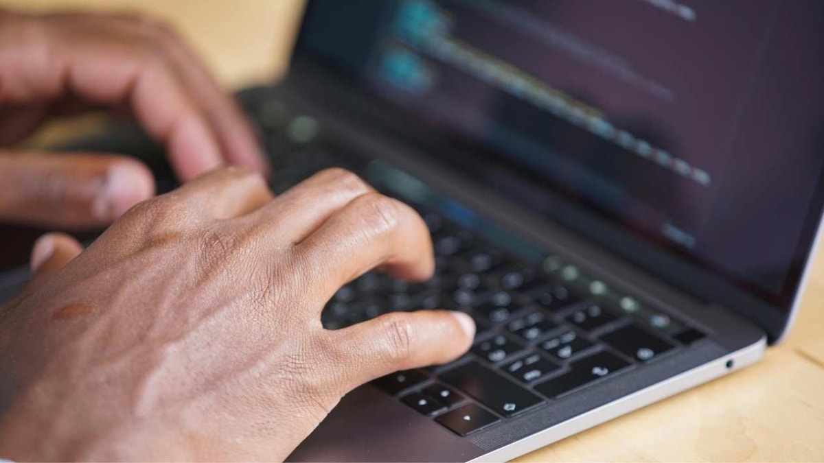 Person typing on computer